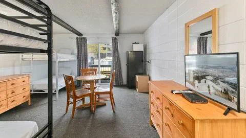 Image of table and tv in Snowshoe Inn employee housing.