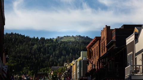 Historic Main Street building in Park City, UT with Bald Mountain in the background