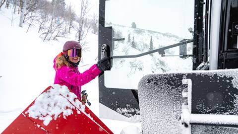 Woman entering a snowcat at Deer Valley