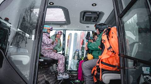 Skiers sitting inside snowcat at Deer Valley