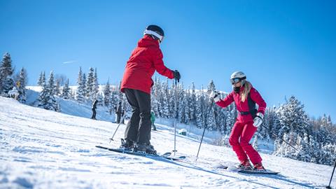 Jillian Vogtli instructing a female skier at Deer Valley.