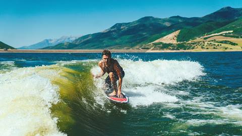 Man wake surfing in the Jordanelle Reservoir.