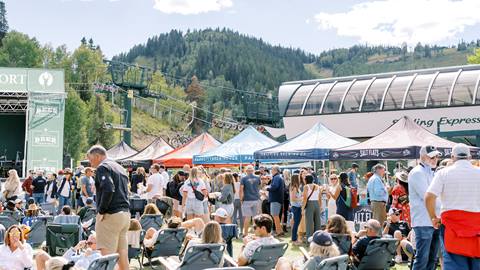 Guests standing by beer tents at Deer Valley Mountain Beer Festival.