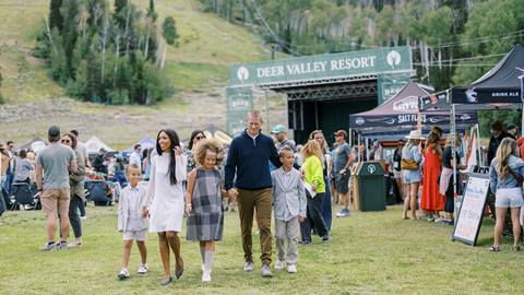 Family walking together at Deer Valley Mountain Beer Festival.