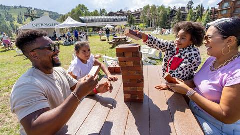 Family playing a game of Jenga at Silver Lake.