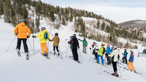 Deer Valley Mountain Host giving a group ski tour.