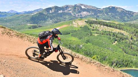 Biker with mountains in the background