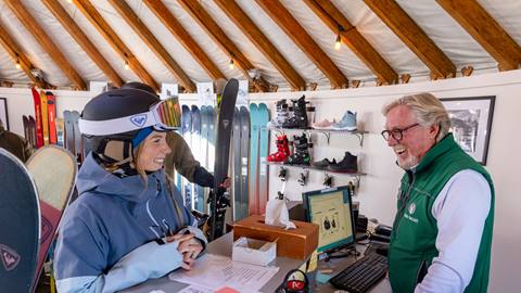 Deer Valley staff helping a guest with demo skis at the Rossignol High Performance Test Center.