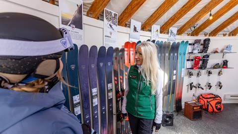 Deer Valley staff helping a guest with demo skis at the Rossignol High Performance Test Center.