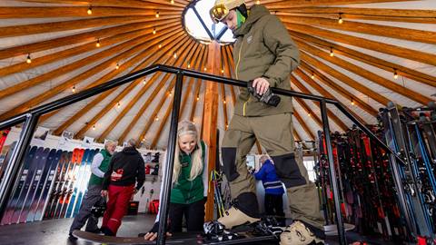 Deer Valley staff helping a guest with demo skis at the Rossignol High Performance Test Center.