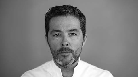 Chef Davide Palluda's headshot.