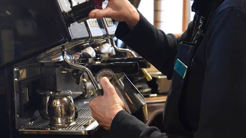 Barista making coffee.