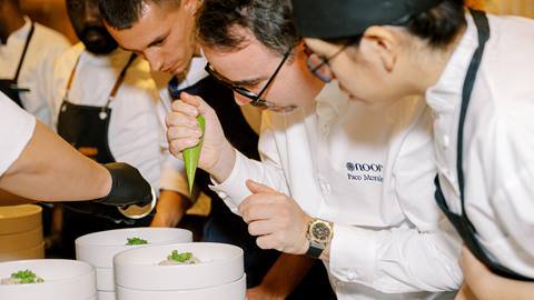 Chef Paco Morales plating dinner at Deer Valley during Taste of Luxury event.