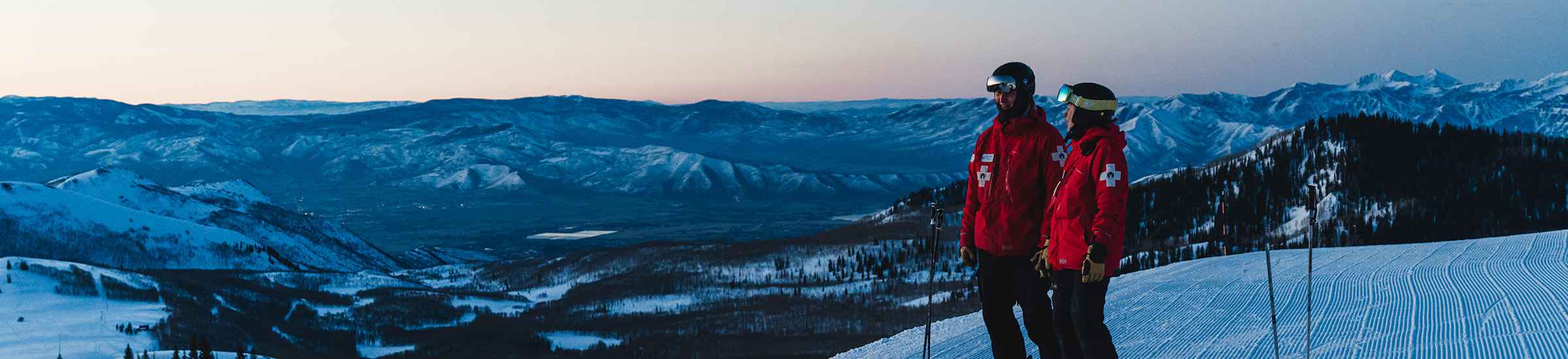 Deer Valley ski patrollers looking off into the distance.