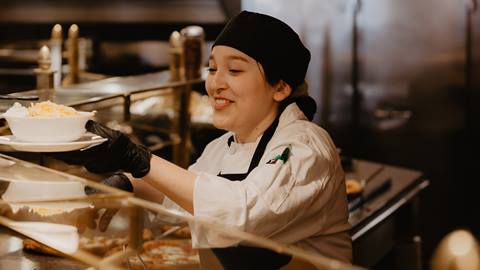 Deer Valley Food and Beverage staff member serving food 