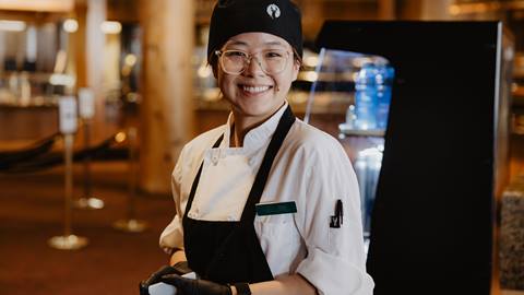 Deer Valley Food and Beverage staff member in uniform smiling for photo