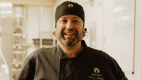 Deer Valley Food and Beverage staff member in uniform smiling for photo