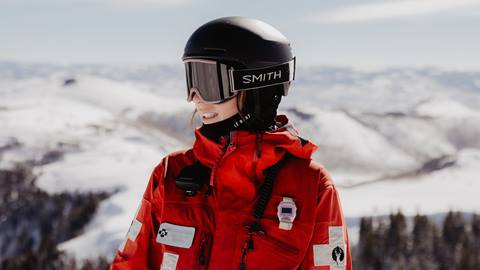 Deer Valley Ski Patrol team member looking off into the distance.