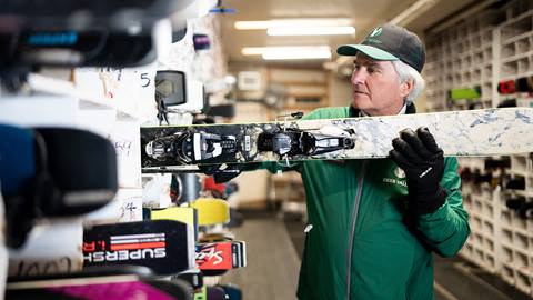 Deer Valley staff member storing skis.