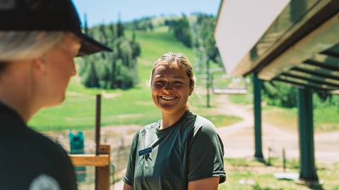 Deer Valley staff member smiling in the summer.