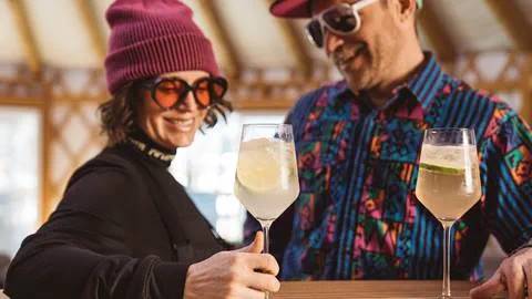 Couple drinking cocktails inside Deer Valley's après-ski yurt, Chute Eleven.