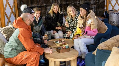 Six guests dining at Deer Valley's après-ski yurt Chute Eleven