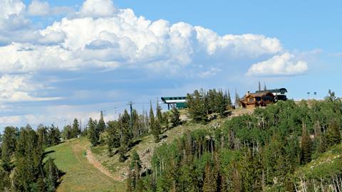 Exterior view of Ruby Chairlift and Cushing's Cabin in summer.