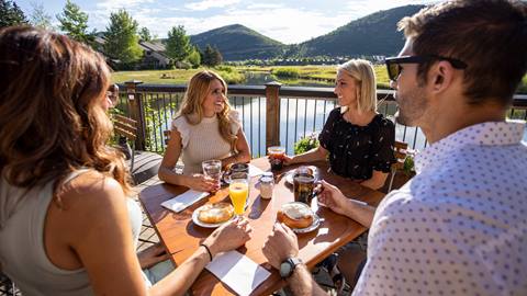 Guests eating on Deer Valley Cafe deck during the summer.