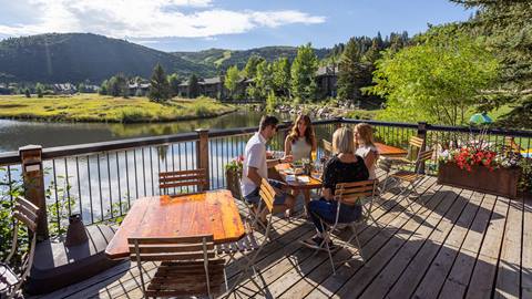 Guests eating on Deer Valley Cafe deck during the summer.
