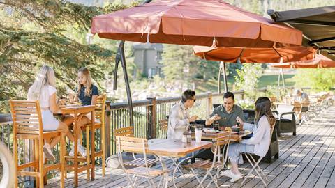 Guests eating lunch on the Deer Valley Cafe deck during the summer.