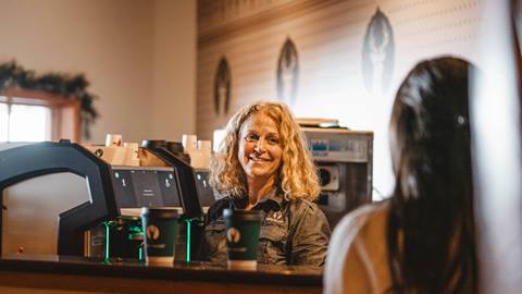 Woman ordering from barista at Deer Valley ETC.