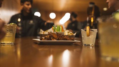 Chicken wings and cocktails at Edgar's après-ski bar in Deer Valley.