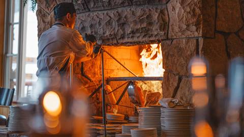 Deer Valley staff working at fireplace at Fireside Dining.