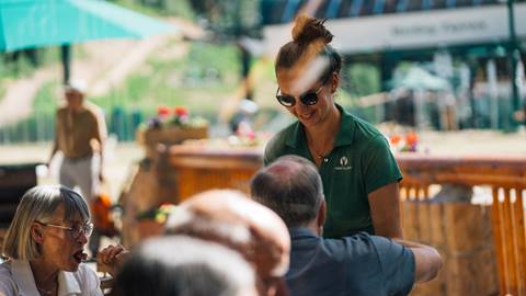 Deer Valley staff helping guests on deck at Royal Street Café.