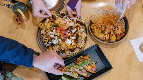 Waffle fries and tuna tacos at Royal Street Café.