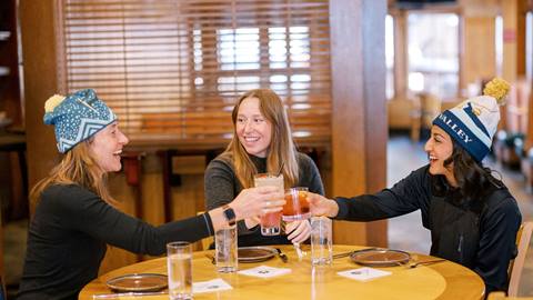 Guests doing a cheers with drinks at Royal Street Café.