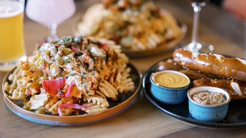 Detail shot of waffle fries and pretzels from The Sticky Wicket.