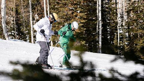 Deer Valley ski instructor teaching guest to ski.