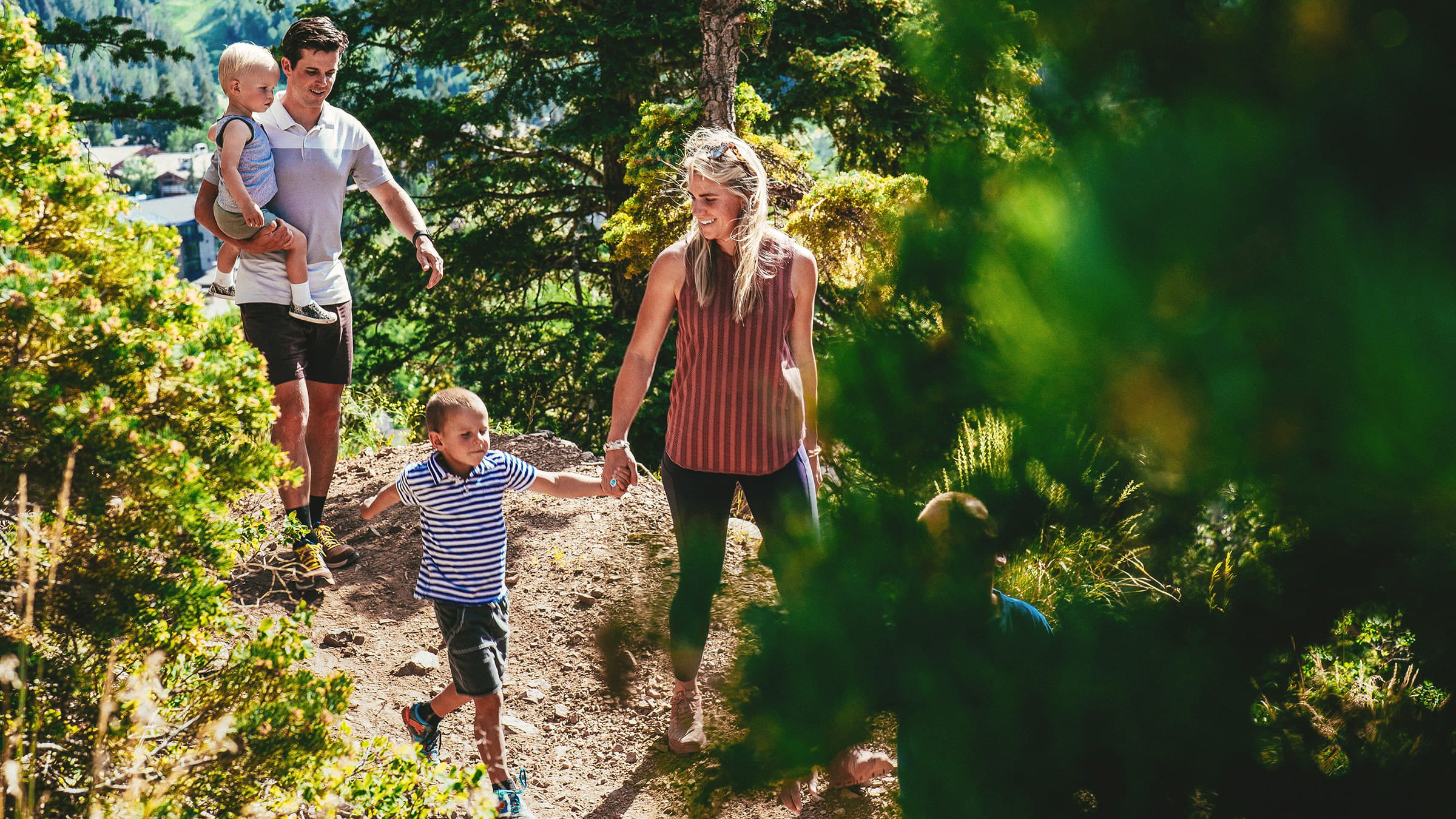 Parents with two young kids hiking at Deer Valley.