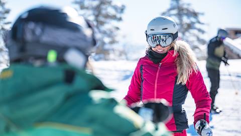 Guest smiling at Deer Valley ski instructor.