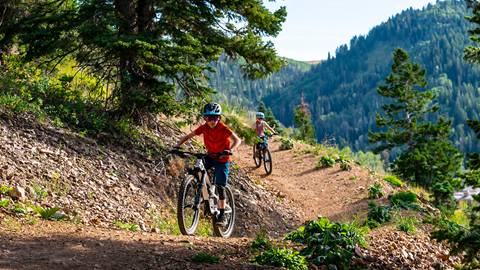 Two kids mountain biking on Ripple.