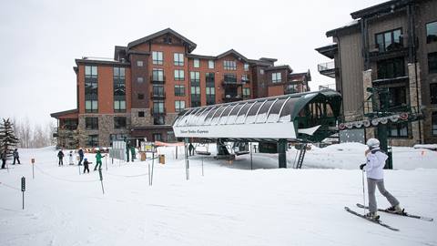 Exterior view of Argent at Empire Pass lodge during winter.