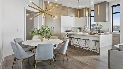 Dining table and kitchen in Deer Valley's luxury vacation rental SkyRidge 11494.