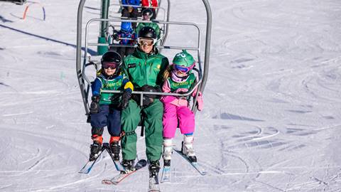 Kids on chairlift with Deer Valley ski instructor.