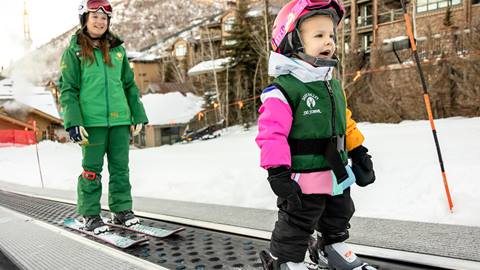 Girl on conveyor in Deer Valley ski lesson.