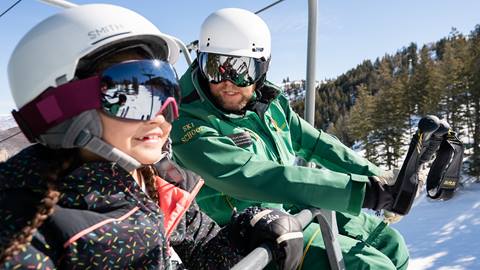 Deer Valley ski instructor with young girl student.