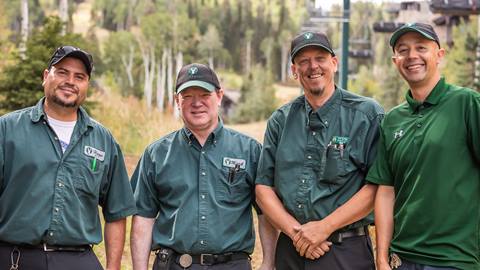 Deer Valley Lodging Maintenance team smiles for a group photo.