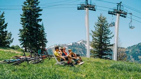 Family sitting at the top of Bald Mountain after mountain biking