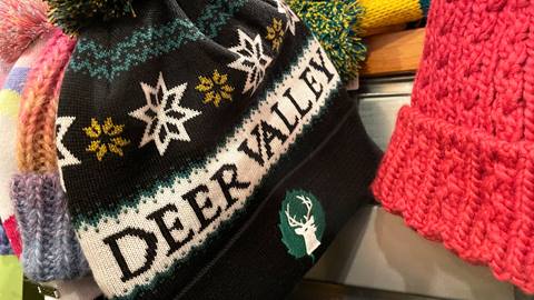 Black and green Deer Valley logoed beanie