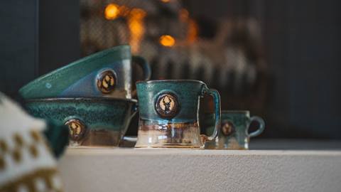 Deer Valley pottery mugs and bowls.